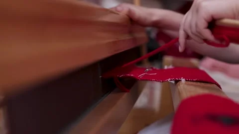 Artisan Weaving Red Textile on Traditional Loom Stock Footage 338189889