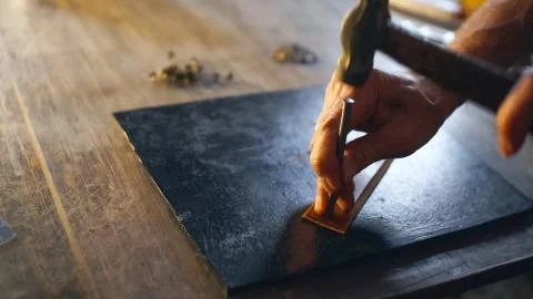 Artisan working with leather. Stock Photos