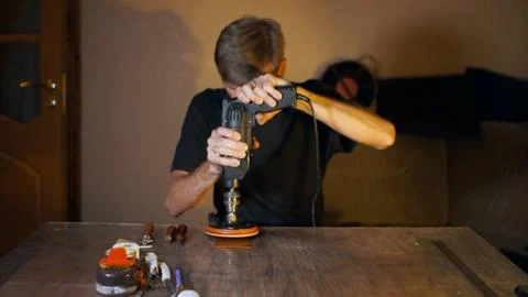 Artisan working with leather. Stock Photos