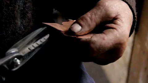 Artisan workshop that builds a belt for a Tyrolean tracht Stockbeeldmateriaal 77020681