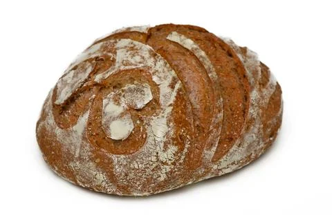 Artisanal bread with intricate patterns resting on a clean surface shines i.. Stock Photos