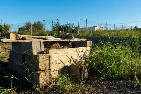 Artisanal composter built rustically, is full of branches and biological re.. Stock Photos