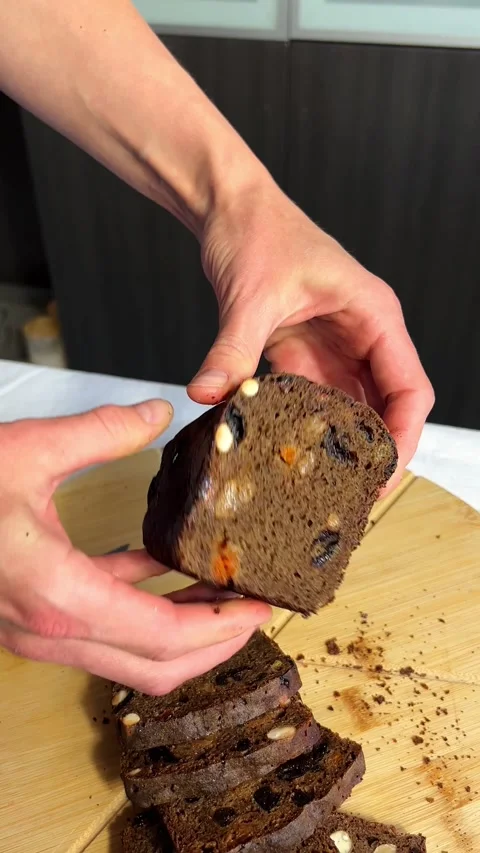 Artisanal gluten free bread held with care. Perfect for small bakery branding Stock Footage 314712671