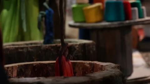 Artisanal Process of Dyeing Textile Threads in Colorful Dyes for Rug Making Stock Footage 325513954