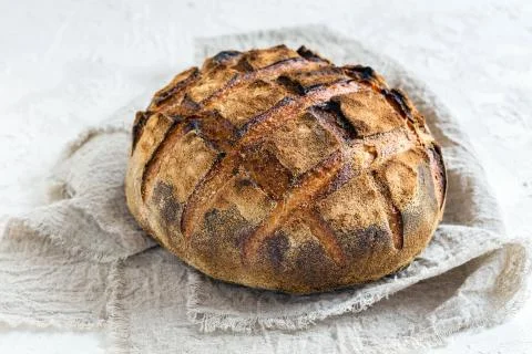 Artisanal rustic bread from wheat and rye flour. Stock Photos