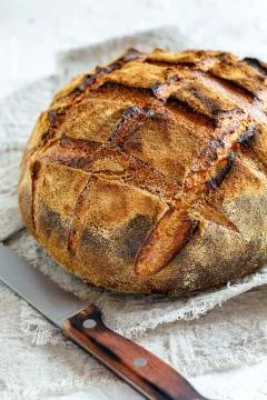 Artisanal rustic bread from wheat and rye flour. Stock Photos