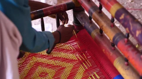 Artisanal Weaver Threading String To Make Chair In Sindh, Pakistan 動画素材 243338746