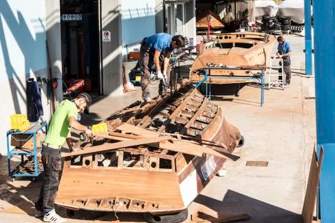 Artisans at work in the construction of boats Stock Photos
