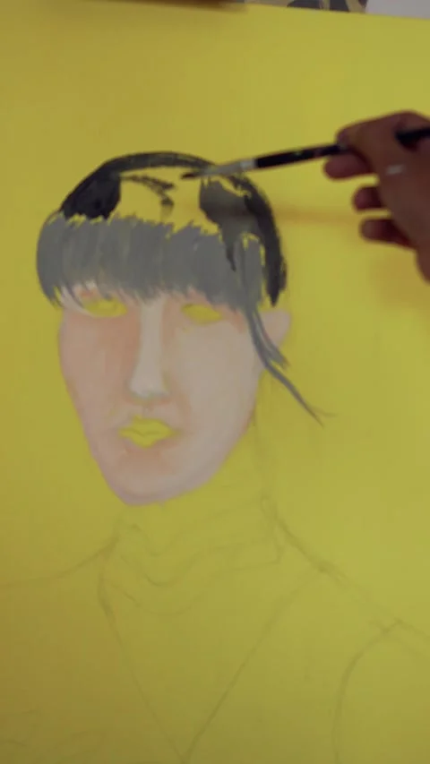 An artist applying paint to a canvas using a brush Stock Footage 310151253