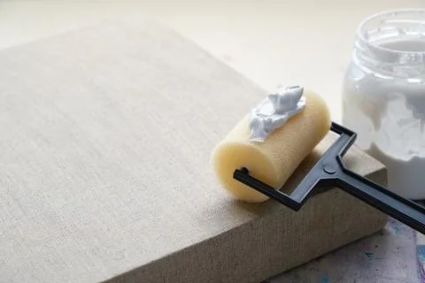 Artist brush roller for canvas coating and linen artistic canvas. Stock Photos
