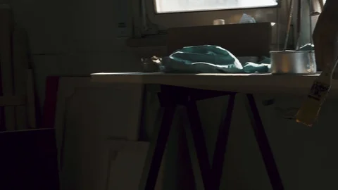 Artist casting his shadow on the canvas Stock Footage 128687082
