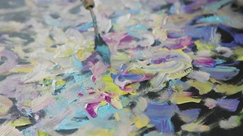 Artist creates an multi colored picture using palette knife and oil paints Stock Footage 158505267