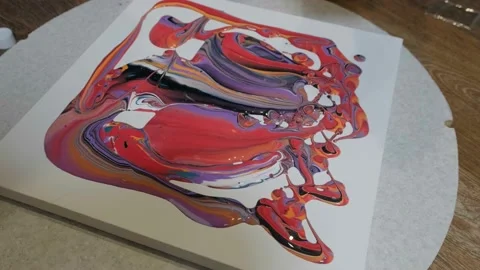 The artist creates a picture using liquid ink. Painting with liquid ink Stock Footage 194583148