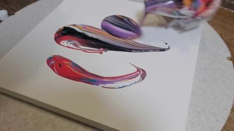 The artist creates a picture using liquid ink. Painting with liquid ink Stock Footage 195122331