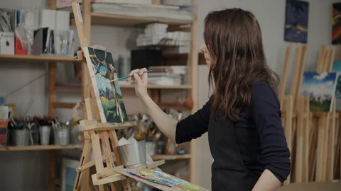 Artist creating landscape painting in studio Stock Footage 115278853
