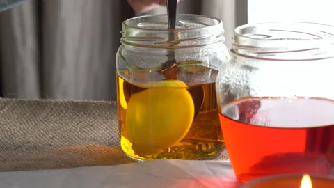 Artist dip in the color Easter eggs with traditional bee-wax painting technique Stock Footage 149583259