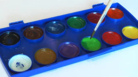 Artist dips the brush into the paint Stock Footage 48078662