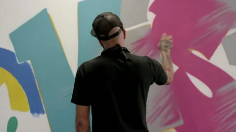 Artist doing graffiti on wall. Stock Footage 63431442