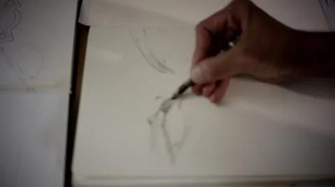 Artist drawing on book at studio. Stock Footage 63428358