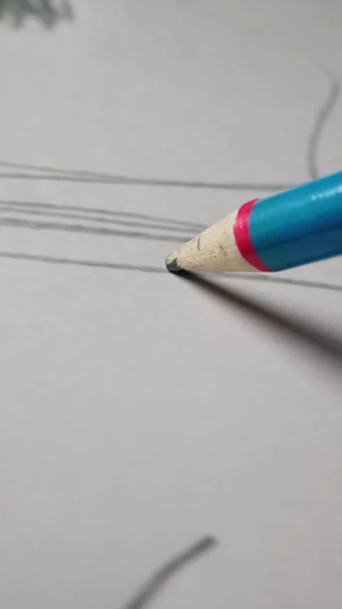 Artist Drawing Straight Graphite Lines with Blue Mechanical Pencil on Paper Stock Footage 339366074