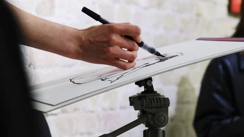 Artist draws mannequin using technical pen and piece of paper 스톡 동영상 316148545