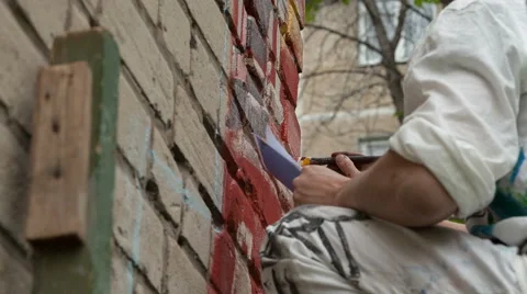 Artist draws on the wall Stock Footage 63030040