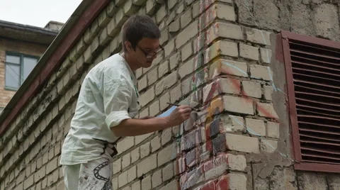 Artist draws on the wall Stock Footage 63031919