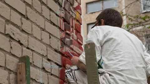Artist draws on the wall Stock Footage 63032847