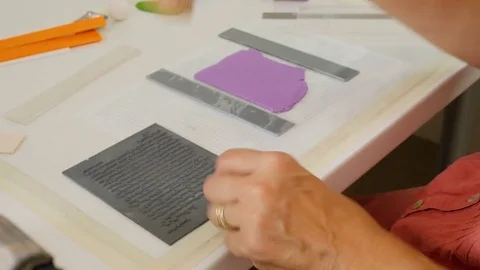 Artist engraves pattern into soft polymer clay for her next arts and crafts Stock Footage 77932326