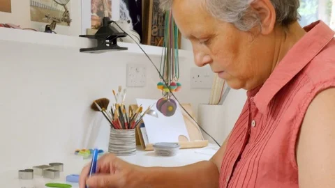 Artist engraves pattern into soft polymer clay for her next arts and crafts Stock Footage 77933971