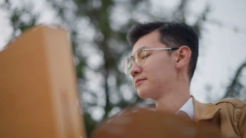 Artist engrossed working. Painter observing canvas amidst evening outdoor Stock Footage 331261431
