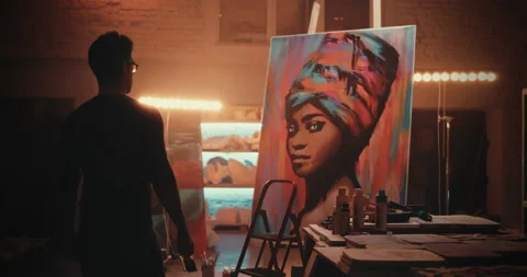 Artist looking on portrait of black woman Stock Footage