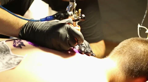 Artist makes a tattoo Stock Footage 66029043
