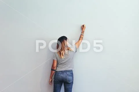 Artist making a sketch on a wall Stock Photos