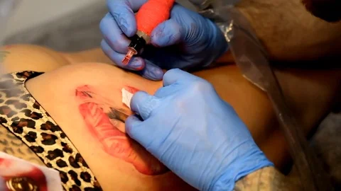 Artist is making the tattoo close up Stock Footage