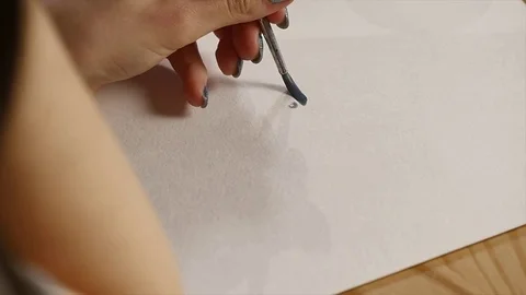 Artist painting with paintbrush close-up Stock Footage