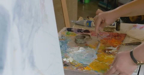 An artist is painting the picture. Video stock 83603853