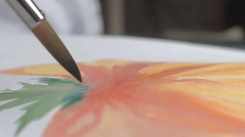 Artist painting watercolor paints on wet paper Stock Footage