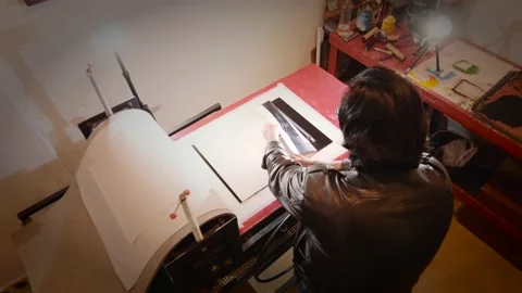 Artist processing a linoleum engraving Stock Footage 157738947