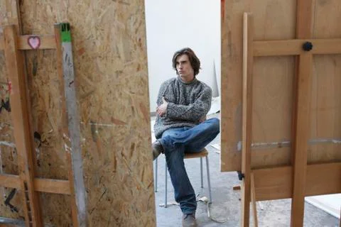 Artist sitting in studio Stock Photos