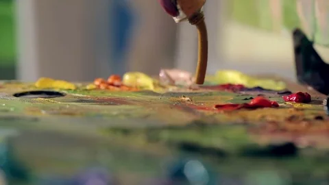 Artist squeezes brown paint on the palette Video stock 74115953