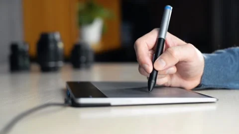 Artist using graphics tablet and electronic pen indoors. 스톡 동영상 197997637
