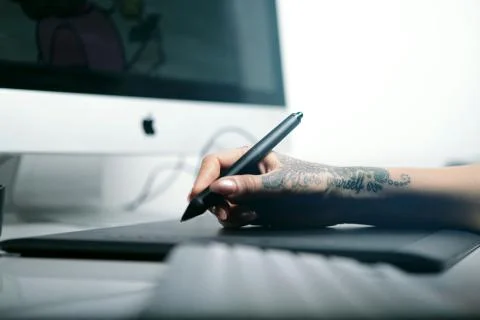 Artist using Tablet to Draw Stock Photos