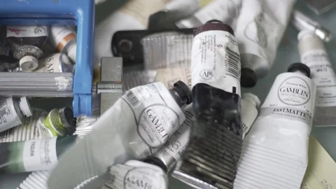 Artist Work Space Handheld Pan Over Tubes Of Paint Ruler Stock-Footage 87875282