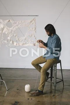 An artist working on an art piece Stock Photos