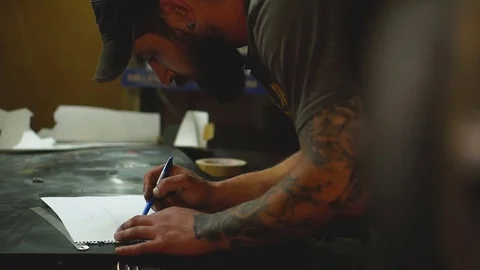 Artist in the workshop makes sketch of a drawing Stock Footage 80931201