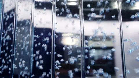 An Artistic Abstract Bubble Reflection onto a Liquid Surface with a Variety of Stock Footage 283359444