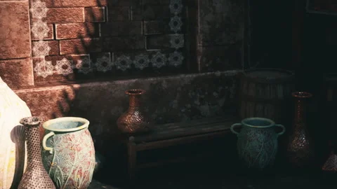 Artistic arrangement of pottery in a rustic indoor setting at sunset Stock Footage 331422181