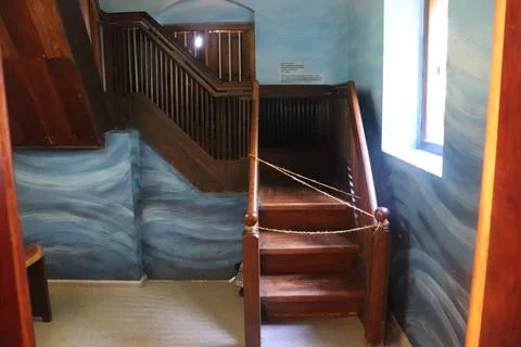 Artistic blue wave painting decorating a heritage house hallway Stock Photos