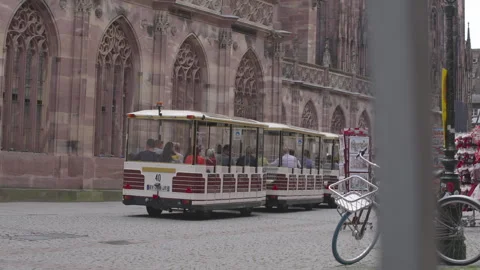 An artistic blur effect captures a tram moving through a historical city Stock Footage 325319412